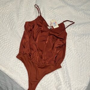 Burnt orange body suit